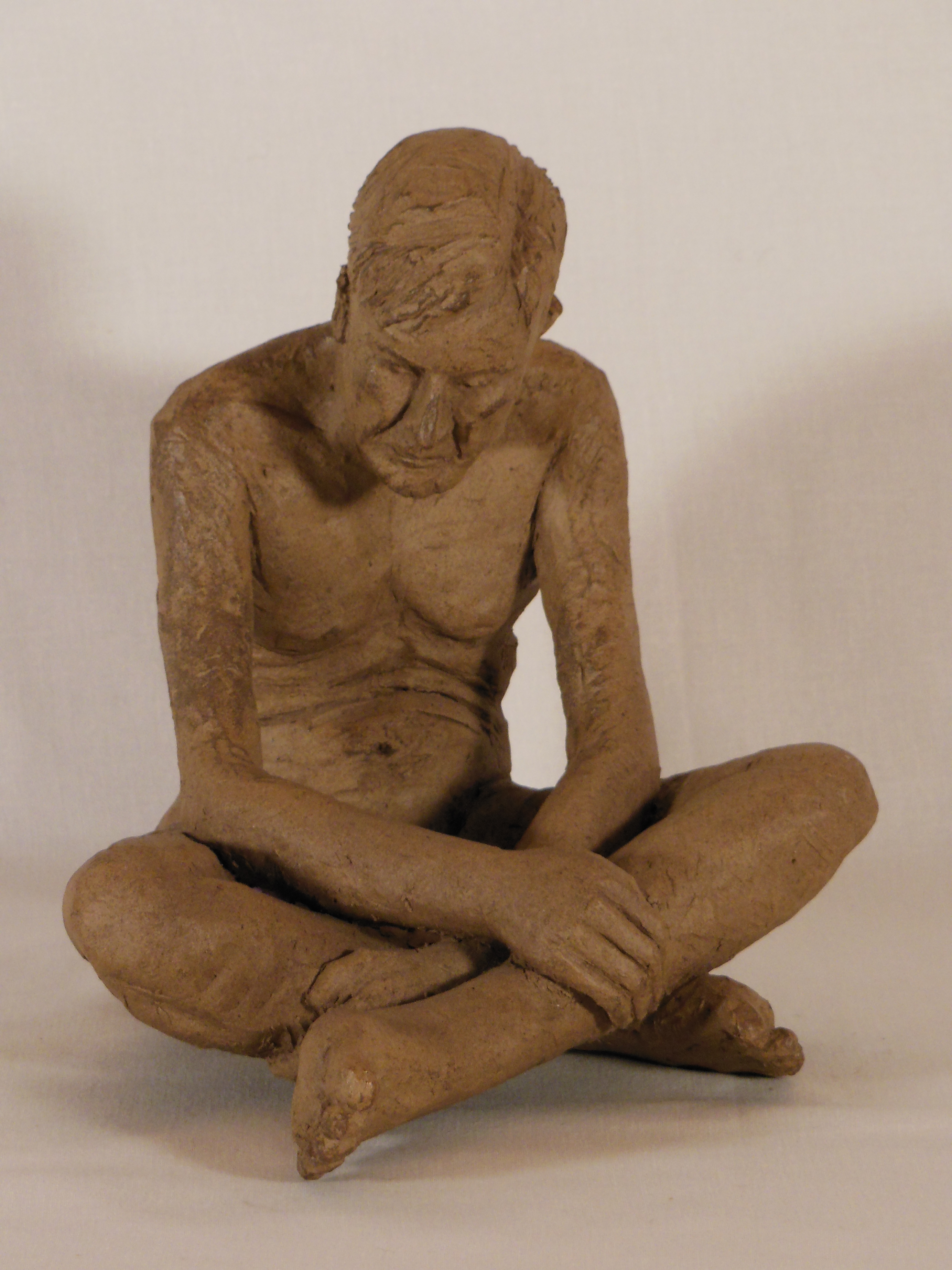 sculpture homme assis
